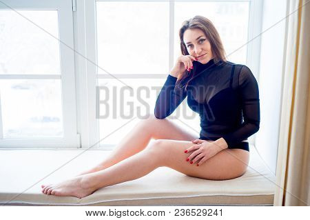 A Portrait Of A Beauriful Woman In A Lingerie