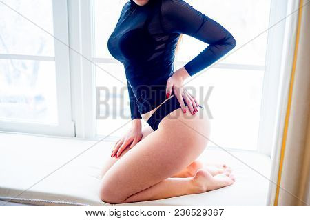 A Portrait Of A Beauriful Woman In A Lingerie