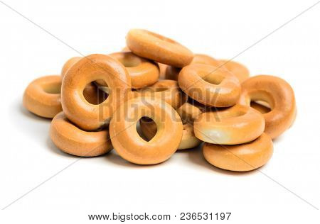 Large pile of bagels on white background