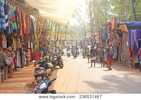 India, Goa, Arambol. January 28, 2018. The Central Street Of Arambol, On Which People Go On Scooters