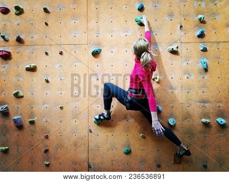 Fitness, Extreme Sport, Bouldering, People And Healthy Lifestyle Concept - Young Girl Exercising At 