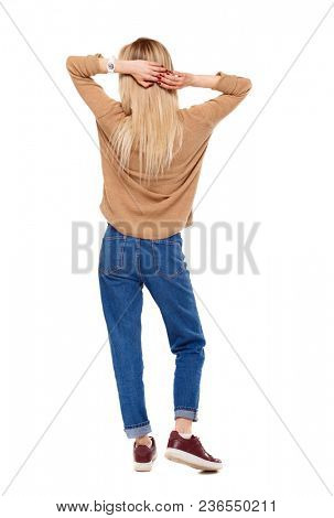 Back view of a woman standing. girl watching. Rear view people collection.  backside view of person. Isolated over white background. The blonde relaxes throwing her hands behind her head