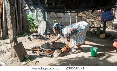 Omo, Ethiopia - September 2017: Ethiopean Woman Cooking Ethiopean Bread Called Injera