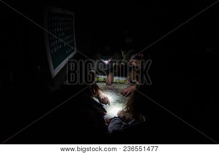 Greece Parnitha Acharne May 2 2018: Volunteers Firefighter In Night, Are Studying The Map