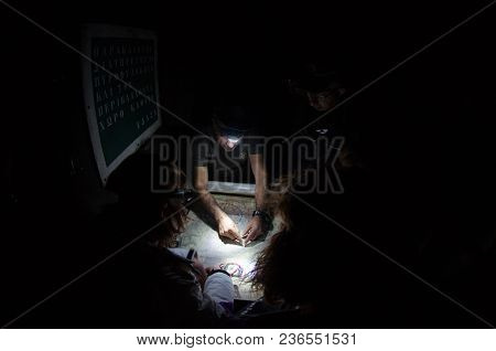 Greece Parnitha acharne may 2 2018: Volunteers firefighter in night, are studying the map