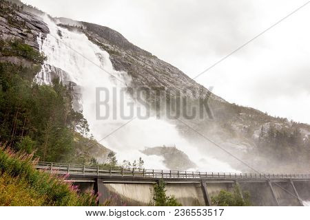 Langfoss Waterfall In Norway During Rainy Weather With Lot Of Water Causing Floods