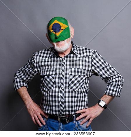 Portrait Of Sad Man With The Flag Of Argentina Painted On His Face. Football Or Soccer Team Fan, Spo