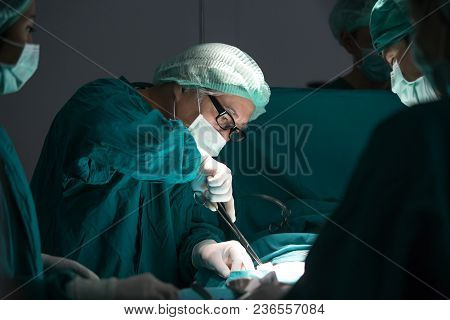 The Surgery Team Working Together At The Operating Room In The Hospital.