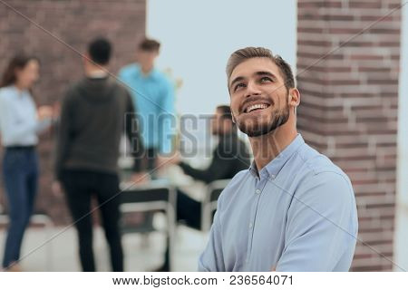 Cheerful man smiling  in office.