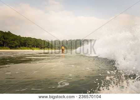 A Big Wave Covers. Radhanagar Beach At Andaman And Nicobar Island, India. View From The Sea. Bursts 