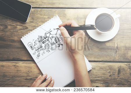 Woman Written Sketching Good Ideas On Notepaad And Coffee And Phone On Tale