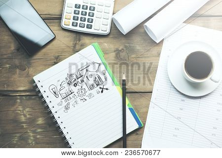 Sketching Good Ideas With Phone And Coffee On Table