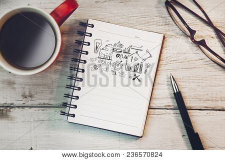 Sketching Good Ideas With Coffee   On Wooden Table