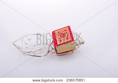 The Holy Quran In Mini Size In A Heart Shaped Cage