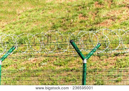 Fence With Razor Barbed Wire. Guarded Area. Military Base. Razor Wire