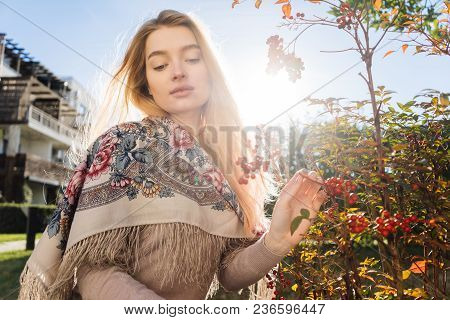 Beautiful Girl Blonde Walks On A Spring Sdu, Enjoys Nature, Plants And The Sun