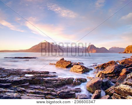 Evening At Loch Scavaig With Cuillins Mountains In Warm Sunset Light.  Isle Of Skye Scotland