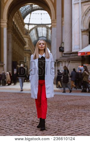 The Galleria Vittorio Emanuele Ii On The Piazza Del Duomo In Central Milano. Woman In Red Pants And 