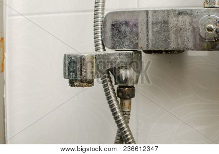 Hard Water Deposit And Rust On Shower Tap