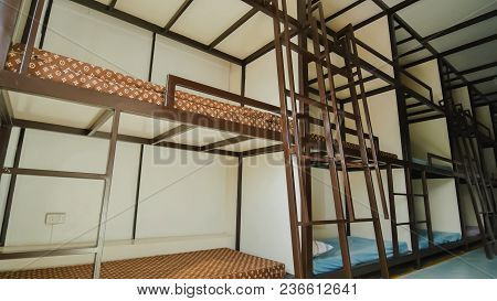 Three-story Beds In A Budget Asian Hostel