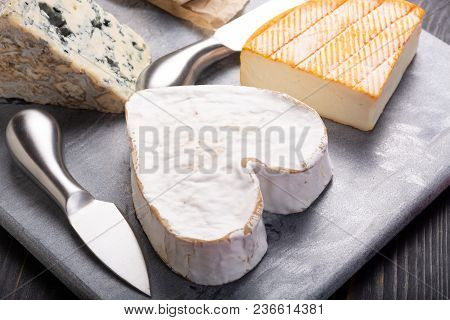 French Cheeses Plate In Assortment,  Neufchatel Heart Shaped Aged White Cow Cheese From Normandy