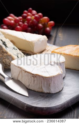 French Cheeses Plate In Assortment,  Neufchatel Heart Shaped Aged White Cow Cheese From Normandy
