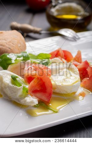 Caprese Salad With Tomatoes, Basil,  Mozzarella Balls, Made With White Ball Mozzarella Buffalo Itali