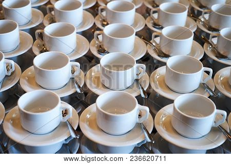 Set Of Empty White Ceramic Tea Or Coffee Cup And Saucers, Top View. Group Of Empty Cups Stacked In R