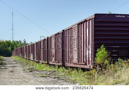 Millinocket, Maine, Usa - September 27, 2011: Long Line Of Boxcars On Siding Near Millinocket, Maine