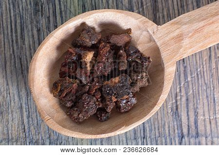 Myrrh Tree Resin In Wooden Spoon On Wood Surface