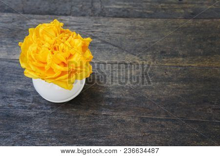 Yellow Flowers On A Wooden Background,view From Above