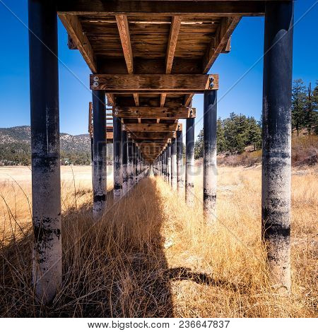 A Wooden Boardwalk Over A Dried Up Lakebed. A Victim Of The Drought And Time.