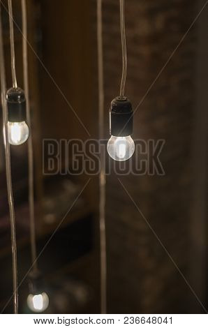 Creative Lighting, Light Bulbs In The Air. Selective Focus.
