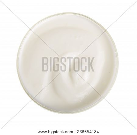 Yogurt In A Wooden Bowl Isolated On White Background Top View.