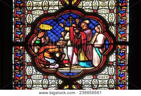PARIS, FRANCE - JANUARY 05: Baptism of Constantine after his victory over Maxentius, stained glass window in the Basilica of Saint Clotilde in Paris, France on January 05, 2018.