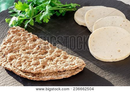 Dietary Homemade Chicken Mortadella With Allspice On Slate Board. Protein Rye Multicereal Flatbread.