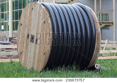 Large Polyethylene Pipes In The Coil For Gas And Water Are Liyng On The Ground. Repair Works.
