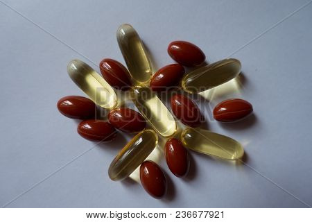 Top View Of Heap Of Fish Oil And Lutein Capsules