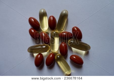 View Of Heap Of Fish Oil And Lutein Capsules From Above