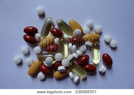 Top View Of Heap Of Four Types Of Pills