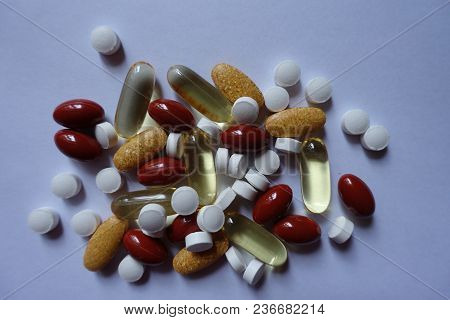 View Of Heap Of Four Types Of Pills From Above