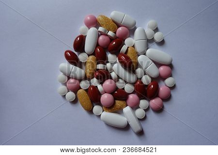 Lutein, Multivitamins, Xylitol, Calcium, Menaquinone Pills In A Heap