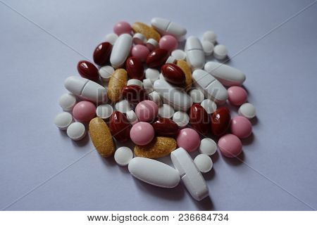 Multivitamins, Xylitol, Lutein, Calcium, Menaquinone Pills In A Heap