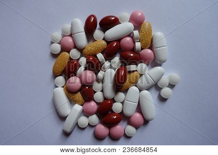 Top View Of Multivitamins, Xylitol, Lutein, Calcium, Menaquinone Pills