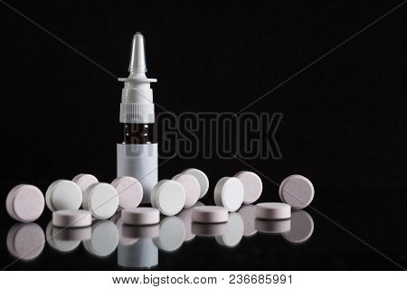 Pill Bottle And Pills In Isolated On Black Concept Pharmacy. With Copy Space.