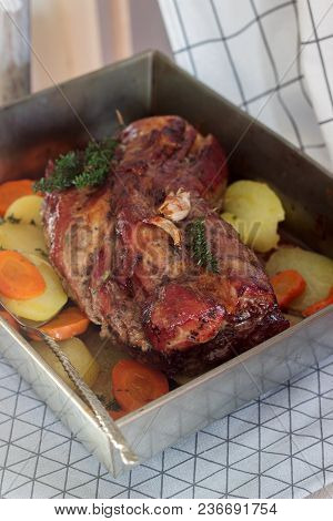 Appetizing Boiled Pork With Potatoes And Carrots, Baked In A Tin Pan. Rustic Style, Selective Focus.
