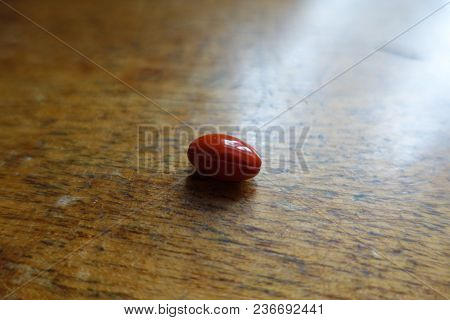 Closeup Of Luitein Capsule On Wooden Table