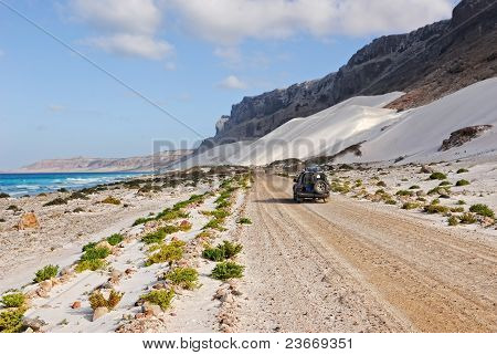 Ocean, Mountain, White Dune And Car