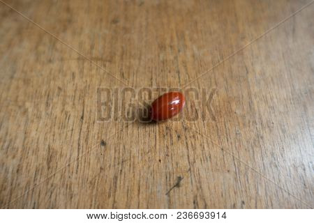 Softgel Capsule Of Lutein Dietary Supplement On Wood