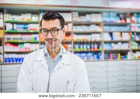 Portrait Of A Young Atrractive Friendly Male Pharmacist.